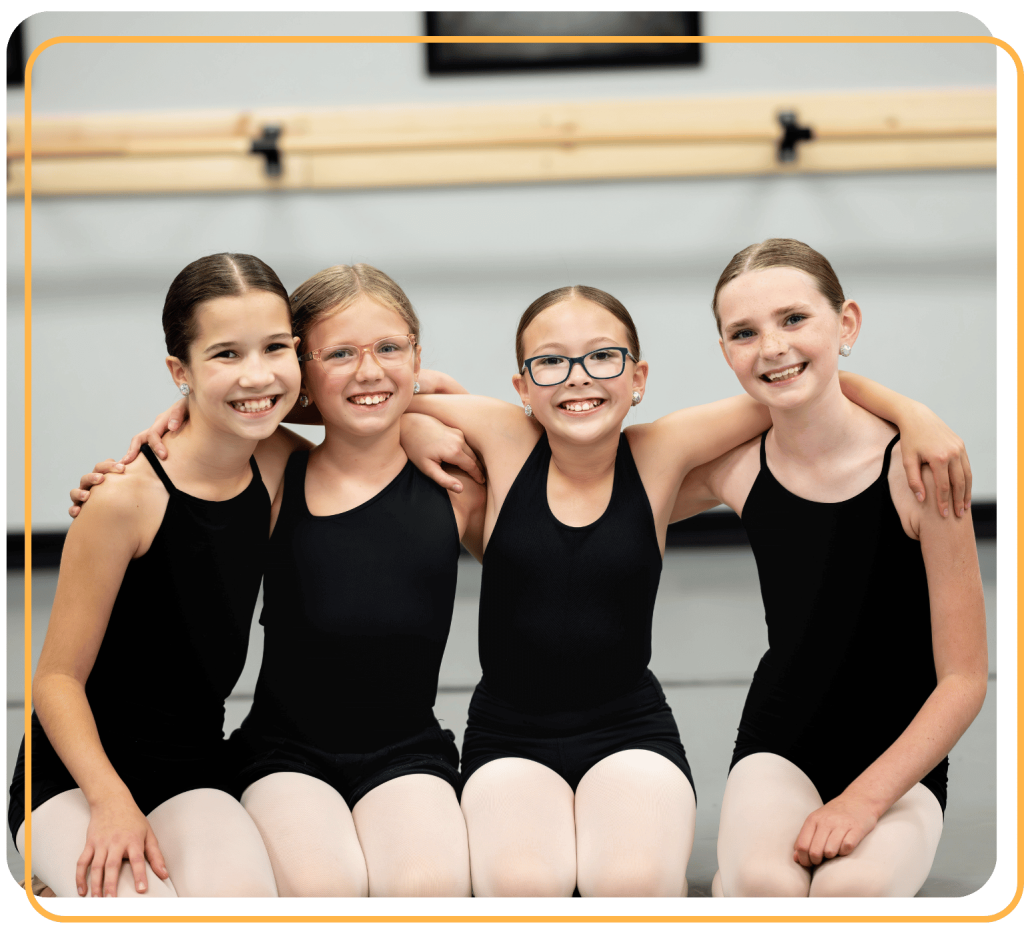 Dancers sitting in dance studio