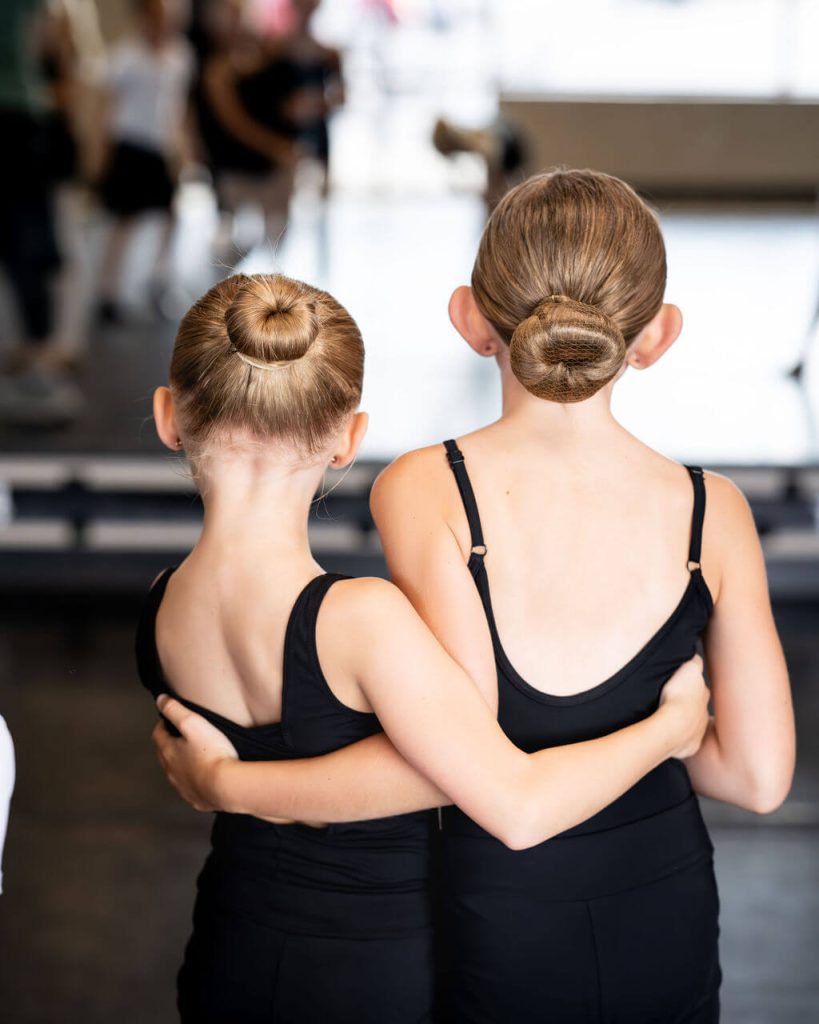 summer dance classes in Shakopee | dancers with arms around each other