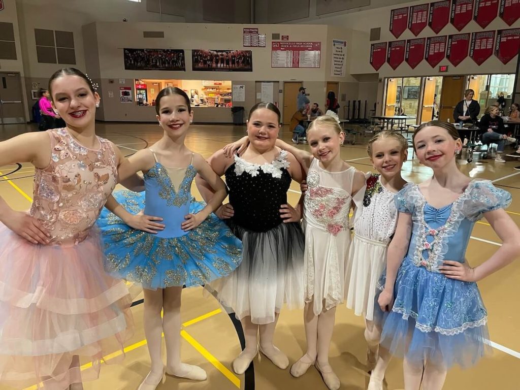 Group of soloist dancers backstage